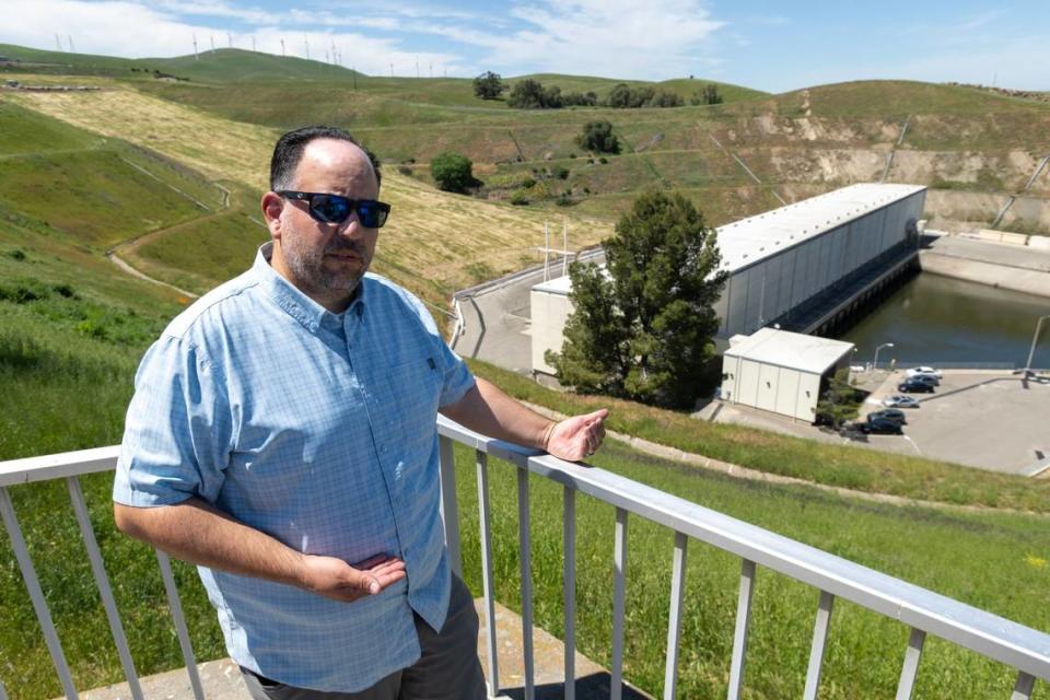 Javier Miranda, environmental program manager for the California Department of Water Resources, stands in front of the Harvey O. Banks Pumping Plant in April. Miranda studies the effectiveness of measures taken to protect fish from the pumping plant.