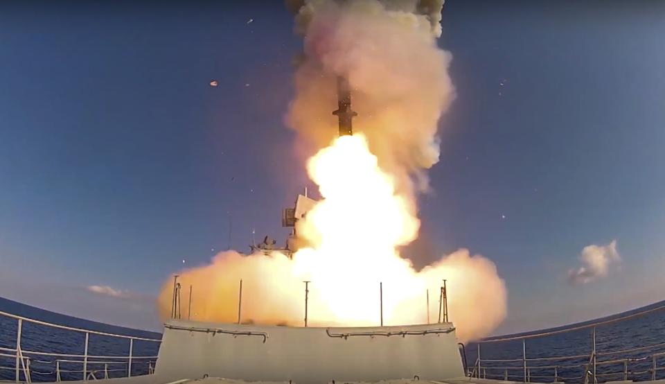 FILE - In this image provided by Russian Defense Ministry Press Service and released on Friday, June 23, 2017, long-range Kalibr cruise missiles are launched by a Russian Navy ship in the eastern Mediterranean. The Russian invasion of Ukraine is the largest conflict that Europe has seen since World War II, with Russia conducting a multi-pronged offensive across the country. The Russian military has pummeled wide areas in Ukraine with air strikes and has conducted massive rocket and artillery bombardment resulting in massive casualties. (Russian Defense Ministry Press Service via AP, File)