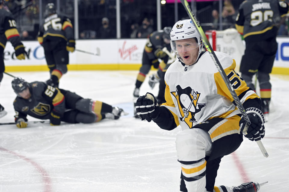 Pittsburgh Penguins left wing Jake Guentzel (59) reacts after scoring against the Vegas Golden Knights during the third period of an NHL hockey game Monday, Jan. 17, 2022, in Las Vegas. (AP Photo/David Becker)