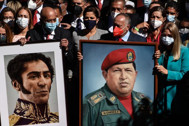 CARACAS, VENEZUELA - JANUARY 5: Jorge Rodriguez (L) President of the National Assembly, Diosdado Cabello Lawmaker (2nd R) and Cilia Flores (R) Lawmaker and First Lady of Venezuela (not seen) arrive the National Assembly holding pictures of Simon Bolivar and Venezuela's Late President Hugo Chavez on January 5, 2021 in Caracas, Venezuela. (Photo by Carolina Cabral Fernandez/Anadolu Agency via Getty Images) (Photo: Anadolu Agency via Getty Images)