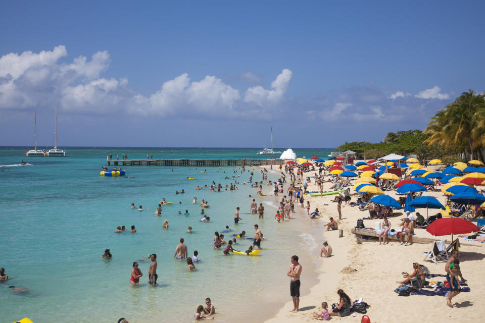 An undated file photo shows people enjoying a sunny day on Doctor's Cave beach, in Montego Bay, St. James, Jamaica. / Credit: Holger Leue/Getty