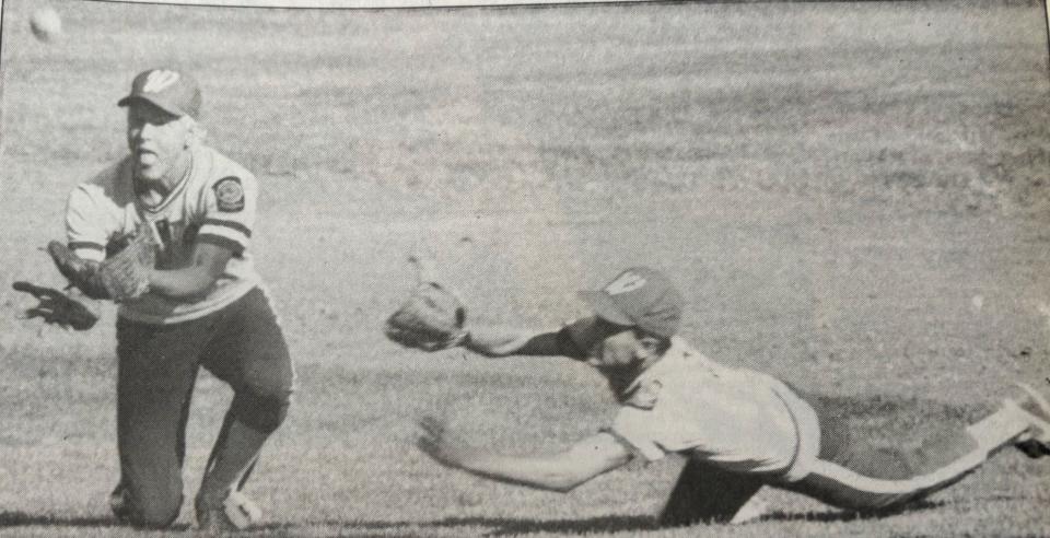 Watertown Post 17 center fielder Brent Sheehan (left) and right fielder Ryan Van Laecken dive to catch a fly ball during the championship game of the 1987 Region 1A American Legion Baseball tournament at Watertown Stadium. Watertown beat Brookings 5-3.