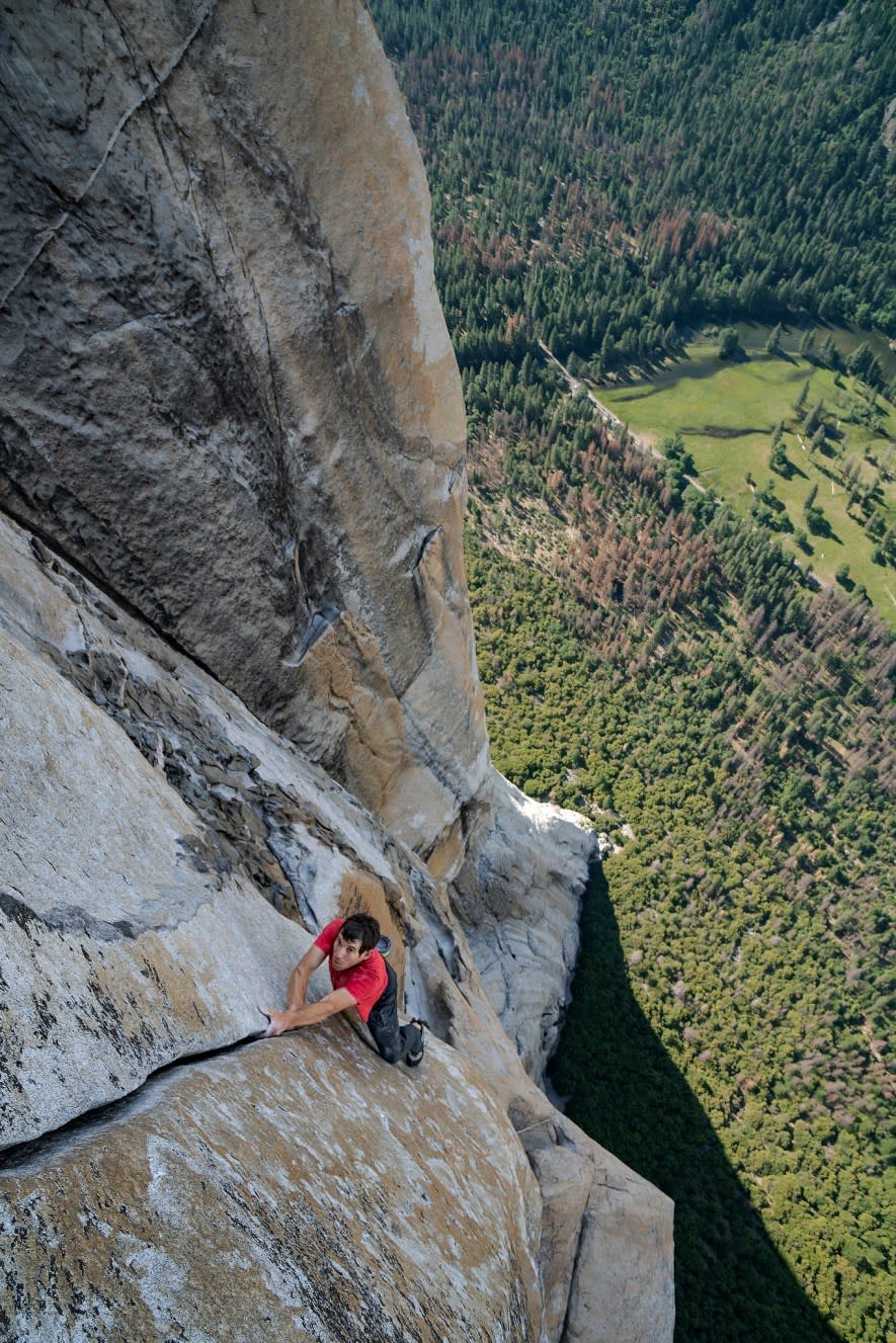 With California’s Yosemite Valley far beneath him, Alex Honnold free solos – which means climbing without ropes or safety gear – up a crack on the 3,000-foot southwest face of El Capitan. (National Geographic/Jimmy Chin)