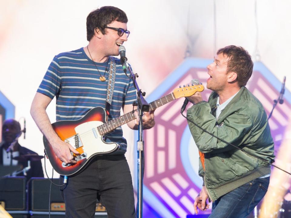 Graham Coxon and Damon Albarn on stage (Getty)