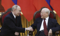 Russian President Vladimir Putin, left, shakes hands with General Secretary of the Communist Party of Vietnam Central Committee Nguyen Phu Trong during a meeting at the Communist Party Central Committee headquarters, in Hanoi, Thursday, June 20, 2024. (Gavriil Grigorov, Sputnik, Kremlin Pool Photo via AP)