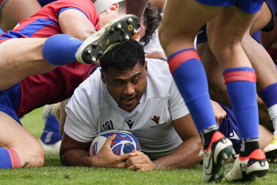 Samoa's Sama Malolo scores a try during the Rugby World Cup Pool D match between Samoa and Chile at the Stade de Bordeaux in Bordeaux, France, Saturday, Sept. 16, 2023. (AP Photo/Christophe Ena)