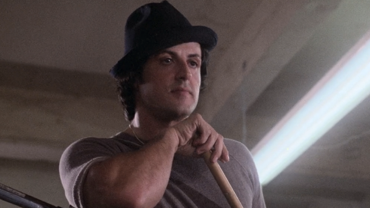  Rocky leaning on broom in Rocky II. 