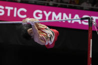 Daiki Hashimoto, of Japan, competes in the horizontal bar during the men's apparatus finals of the FIG Artistic Gymnastics World Championships in Kitakyushu, western Japan, Sunday, Oct. 24, 2021. (AP Photo/Hiro Komae)