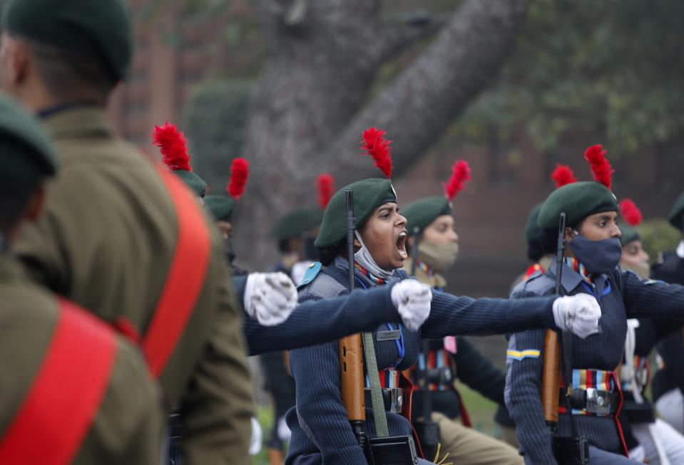 National Cadet Corp students march in a parade as they practice for the upcoming Republic Day parade at the Raisina hills, the government seat of power, in New Delhi, India, Monday, Jan. 18, 2021. Republic Day marks the anniversary of the adoption of the country's constitution on Jan. 26, 1950. Thousands congregate on Rajpath, a ceremonial boulevard in New Delhi, to watch a flamboyant display of the country’s military power and cultural diversity. (AP Photo/Manish Swarup)