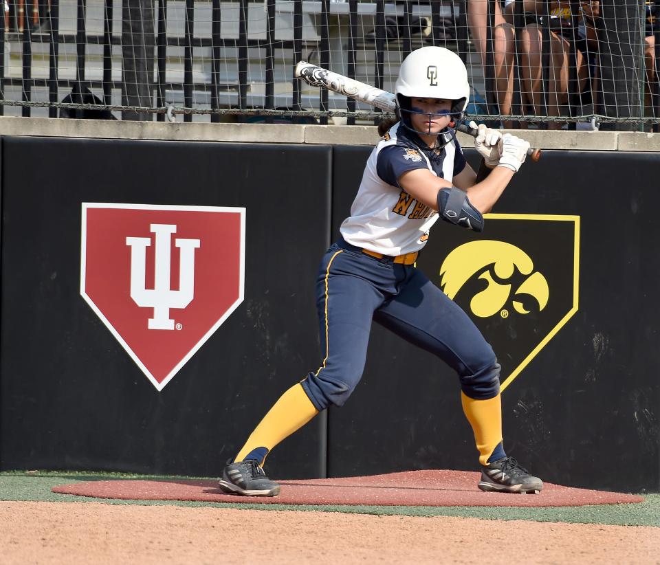 Aly VanBrandt stands in the on-deck circle at Michigan State's Sechia Stadium during the state semifinals. In the background is the University of Indiana logo. VanBrandt will play at Indiana next season.