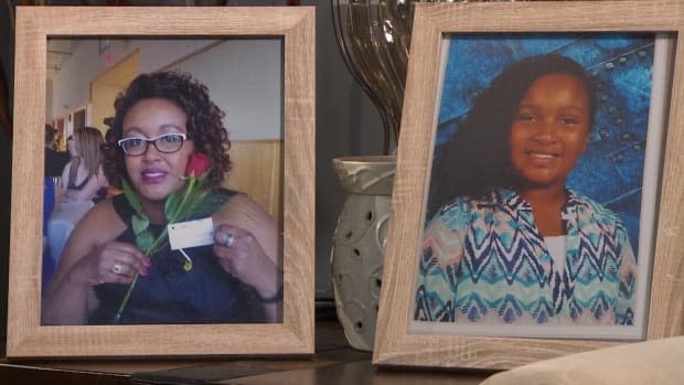 Framed photos of Desmond's wife, Shanna, and daughter, Aaliyah, are displayed in the home of Shanna's parents. 