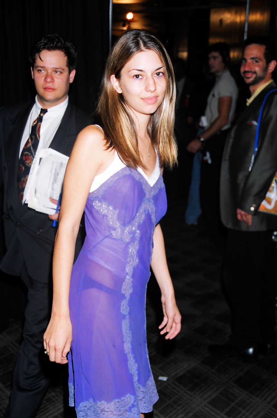 <p>Arriving at the 1995 MTV Video Music Awards, Coppola wears a sheer purple negligee bearing her simple lingerie underneath. </p>
