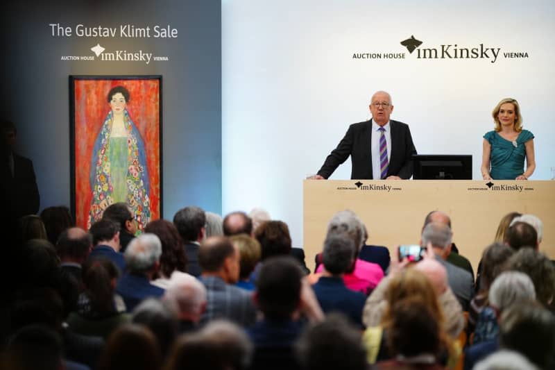 Auctioneer Michael Kovacek announces the sale of the painting "Portrait of Miss Lieser" by Austrian painter Gustav Klimt during an auction. A long-lost portrait of a young woman by Gustav Klimt has been sold for 30 million euros at an auction in Vienna. Eva Manhart/APA/dpa