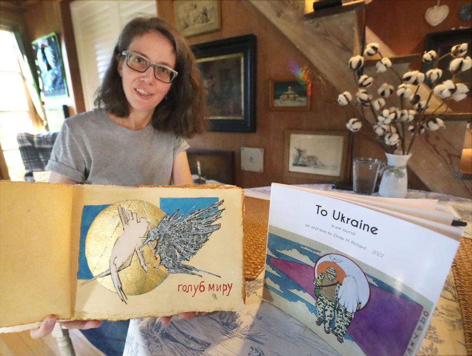 New Smyrna Beach artist Elodie Richard holds the original version of the first of 33 drawings in her artbook project, titled "To Ukraine – A War Journal," illustrating the war in Ukraine, Wednesday, Jan. 11, 2023, in her New Smyrna Beach home.