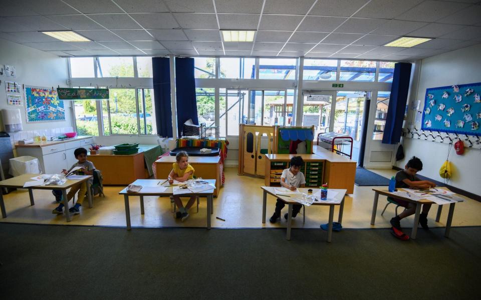 Pupils sit at separate desks at Hiltingbury Infant School in Chandler's Ford, Hampshire this week