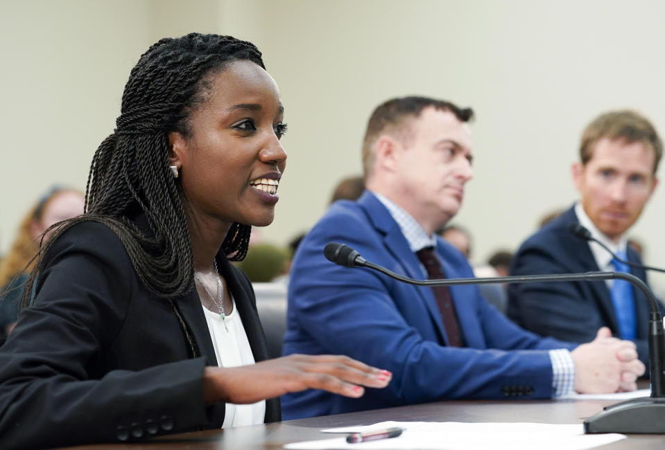 Carine Kanimba speaks during a House Intelligence Committee hearing on Commercial Cyber Surveillance, Wednesday, July 27, 2022, on Capitol Hill in Washington. Kanimba and technology experts urged Congress to oppose the use of commercial spyware in the U.S. and discourage investment in spyware that has been used to hack the phones of dissidents, journalists, and even U.S. diplomats. John Scott-Railton, senior Researcher Citizen Lab, center, and Shane Huntley, Director, Google Threat Analysis Group, right, listen. (AP Photo/Mariam Zuhaib)