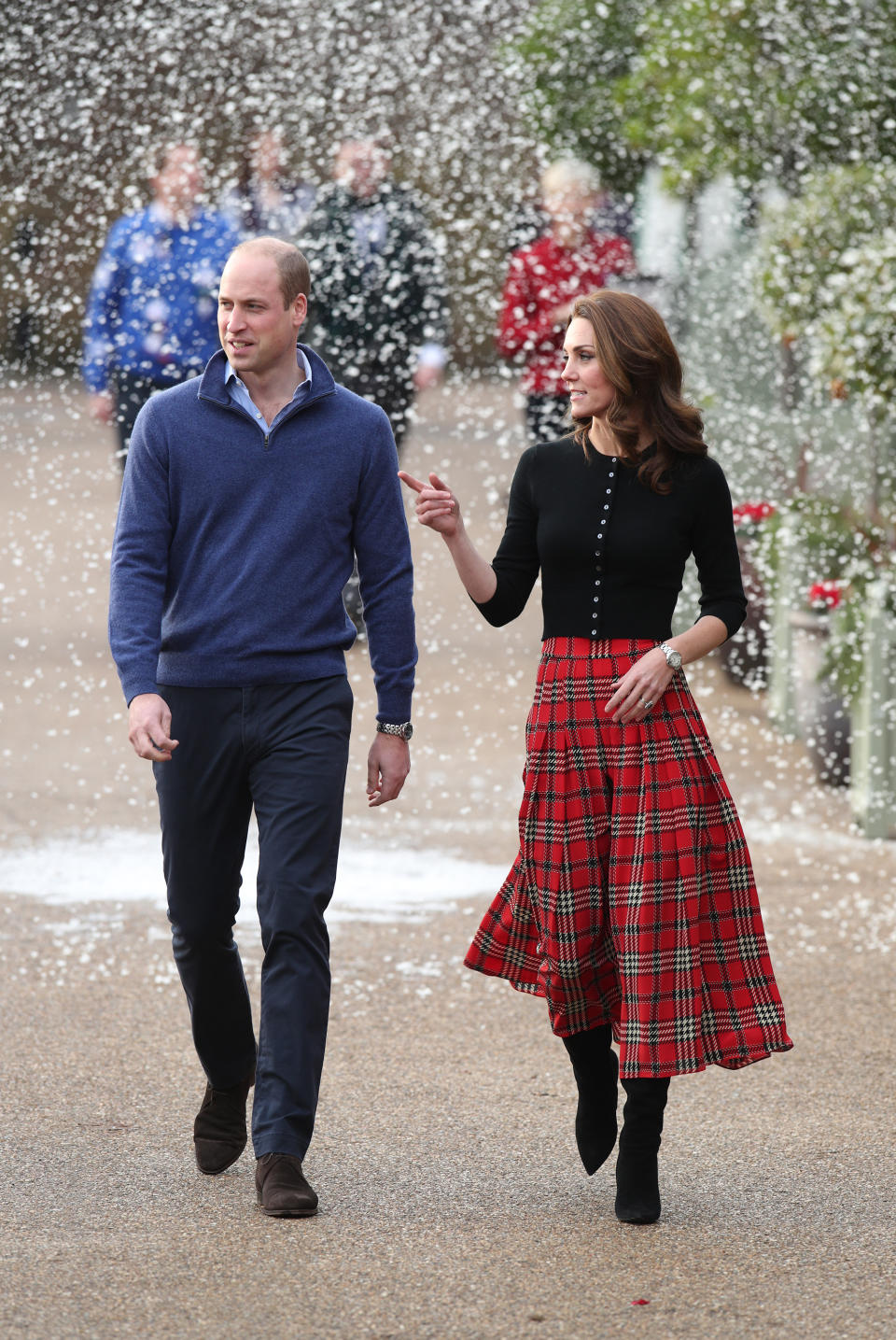 <p>On December 4, the Duke and Duchess of Cambridge threw a Christmas party at Kensington Palace for families and children of deployed personnel from RAF Coningsby and RAF Marham serving in Cyprus. Kate wore a tartan old-season Emilia Wickstead midi skirt and £209 Brora cardigan. <em>[Photo: Getty]</em> </p>