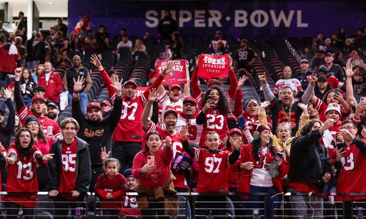 <span>Fans for the San Francisco 49ers cheer during opening night festivities for the Super Bowl, in Las Vegas, on 5 February 2024.</span><span>Photograph: Carlos Avila Gonzalez/AP</span>