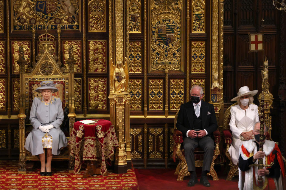 LONDON, ENGLAND - MAY 11:  Queen Elizabeth II in the House of Lord's Chamber with Prince Charles, Prince of Wales and Camilla, Duchess of Cornwall seated (R) during the State Opening of Parliament at the House of Lords on May 11, 2021 in London, England. (Photo by Chris Jackson - WPA Pool/Getty Images)