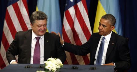 U.S. President Barack Obama meets with Ukraine President-elect Petro Poroshenko in Warsaw June 4, 2014. Obama promised on Tuesday to beef up military support for eastern European members of the NATO alliance who fear they could be next in the firing line after the Kremlin's intervention in Ukraine. REUTERS/Kevin Lamarque (POLAND - Tags: POLITICS) - RTR3S44K