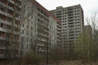 <p>Former apartment buildings stand abandoned in Pripyat, Ukraine (Getty Images) </p>