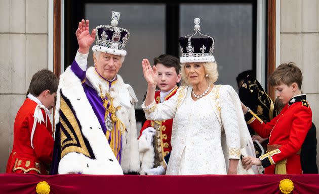 King Charles III and Queen Camilla appear on the balcony of Buckingham Palace following the coronation at Westminster Abbey on Saturday.