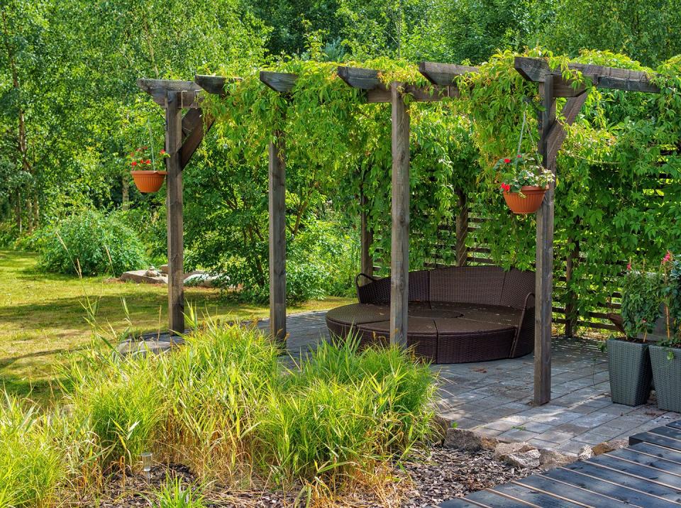 pergola ideas with a trellis garden and seating are