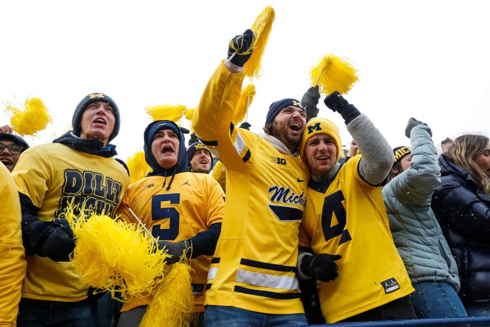 Michigan fans celebrate after Michigan's 42-27 win over Ohio State on Saturday, Nov. 27, 2021, at Michigan Stadium.