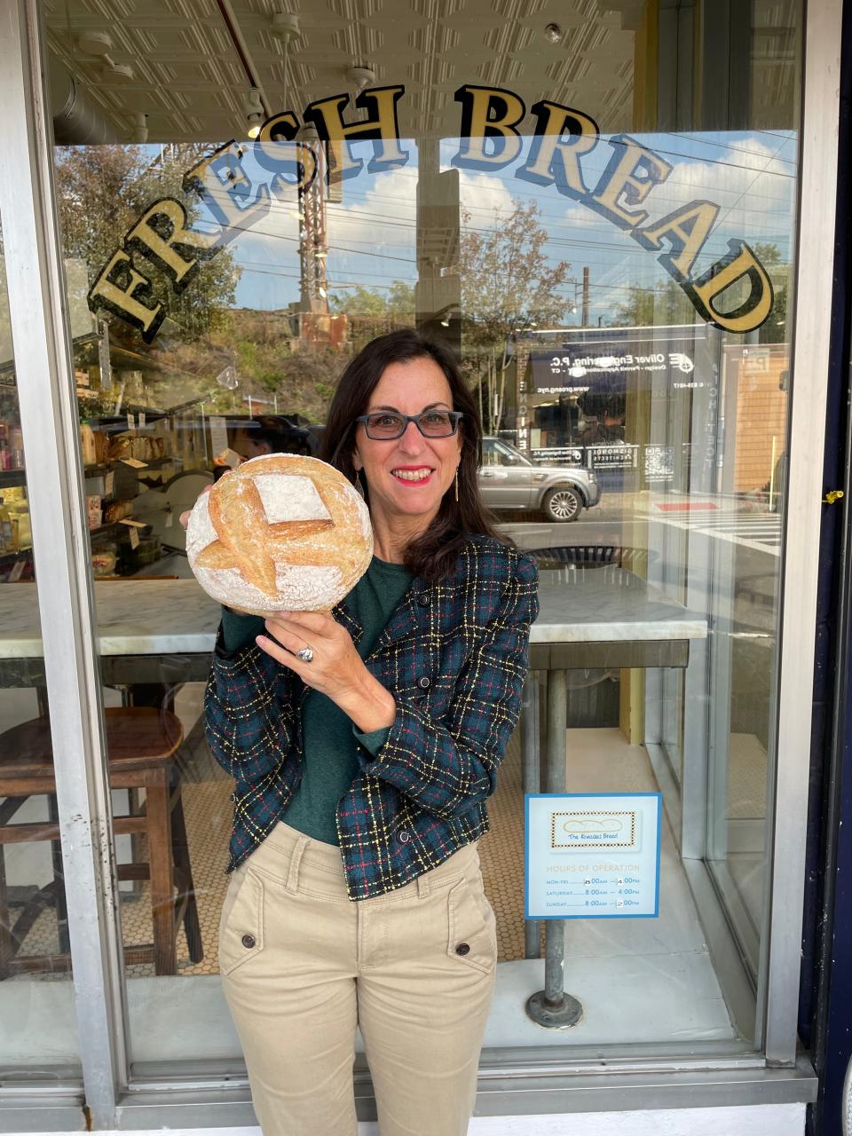 Lohud Food & Dining Reporter Jeanne Muchnick with sourdough bread from The Kneaded Bread in Port Chester. Photographed Oct. 19, 2023