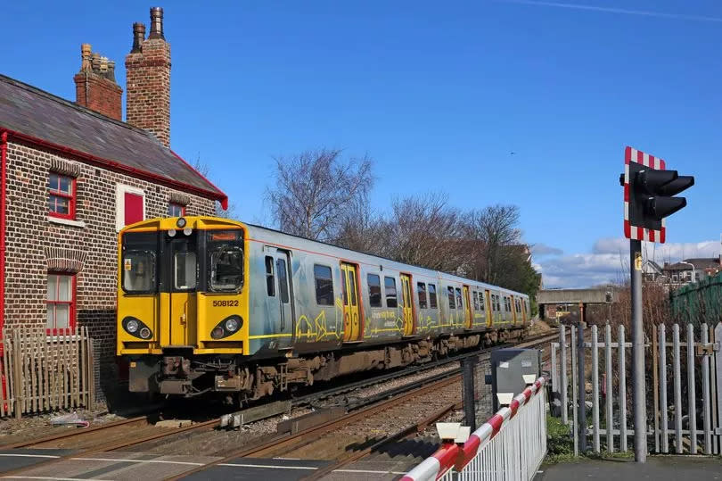 The Hunts Cross to Southport service passing the Portland Street cottage, where the original station was once based