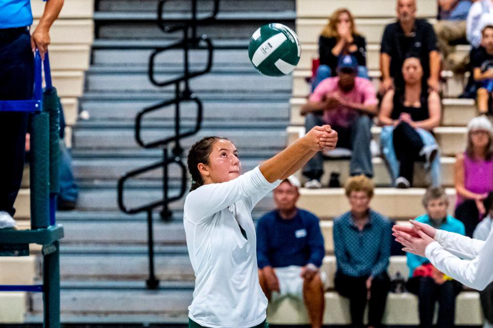 Dartmouth's Lauren Augusto sends the ball over the net.