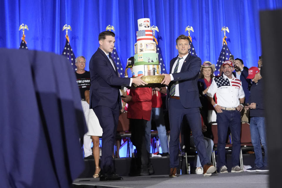 A birthday cake is carried onto the stage before Republican presidential candidate former President Donald Trump speaks at his birthday celebration, hosted by Club 47, in West Palm Beach, Fla., Friday, June 14, 2024. (AP Photo/Gerald Herbert)