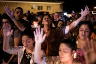 <p>Michaun Johnson attends a candle light vigil after a mass shooting at the First Baptist Church in Sutherland Springs, Texas, Nov. 5, 2017. (Photo: Sergio Flores/Reuters) </p>