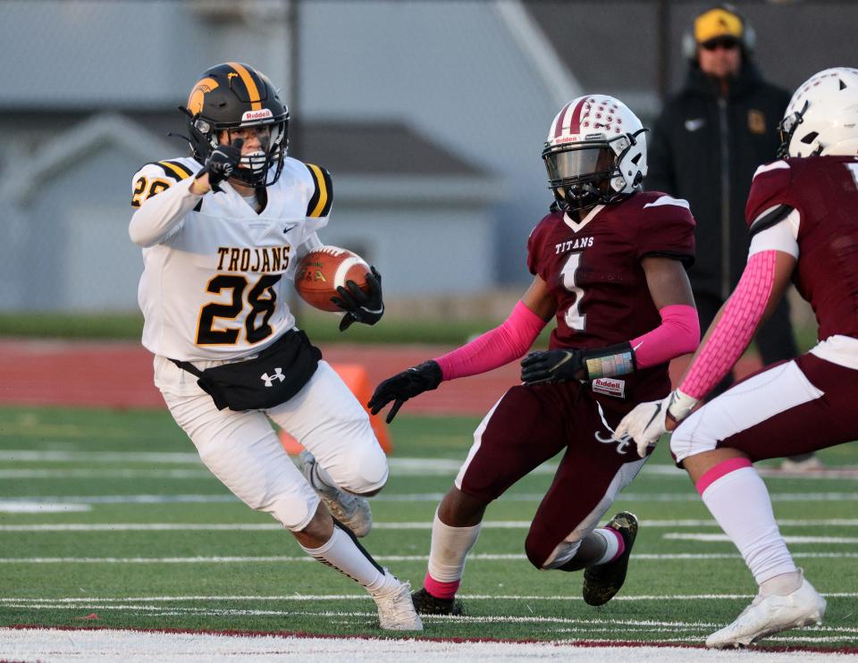 Athena running back Andrew Hill looks for room to run against Arcadia. 