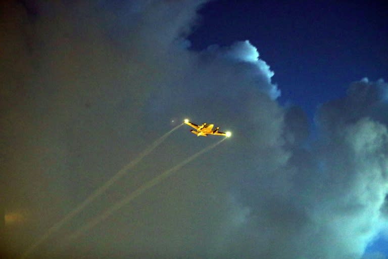 A plane sprays pesticide over the Wynwood neighborhood of Miami, Florida in August, in a bid to control and reduce the number of mosquitos, some of which may be capable of spreading the Zika virus