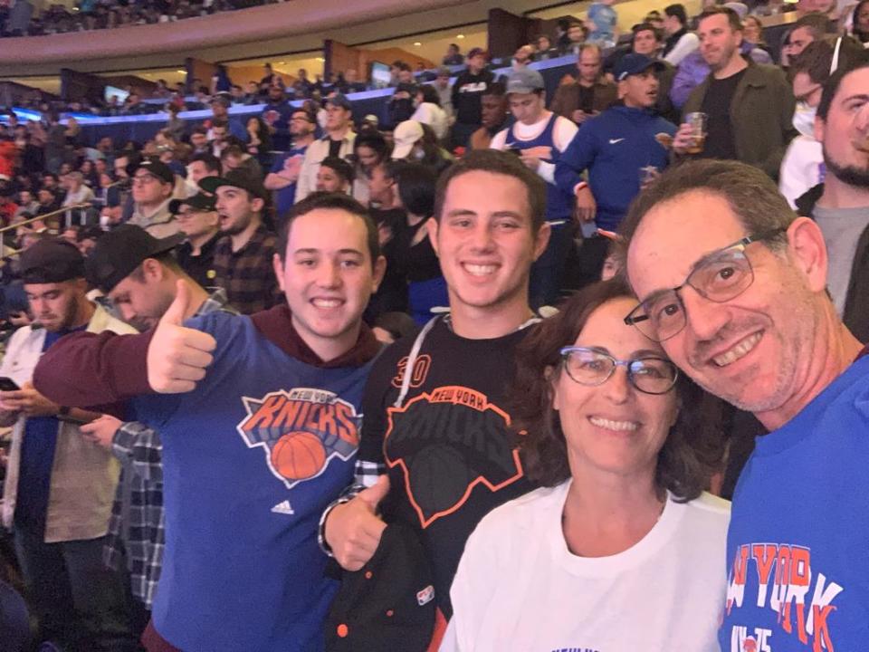 Daniel, Omer, Orna and Ronen Neutra attend a Knicks game at Madison Square Gardens in New York.