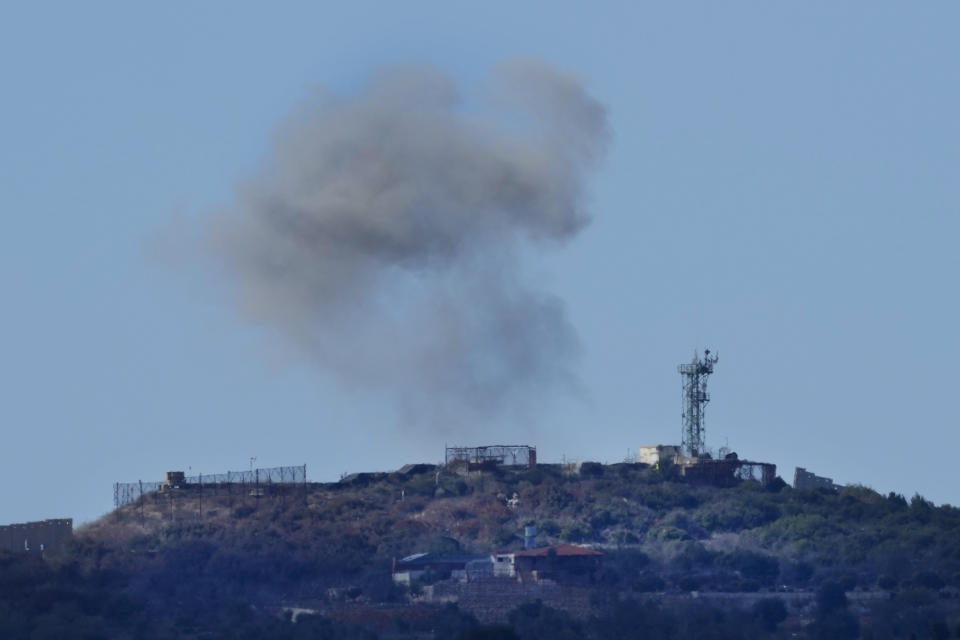 Smoke rises from an Israeli army position which was hit by Hezbollah shells as it is seen from Rmeish, a Lebanese border village with Israel, in south Lebanon, Tuesday, Nov. 21, 2023. Tension has been rising along the Lebanon-Israel border since the Oct. 7 attack by the Palestinian militant group Hamas on southern Israel. (AP Photo/Hussein Malla)