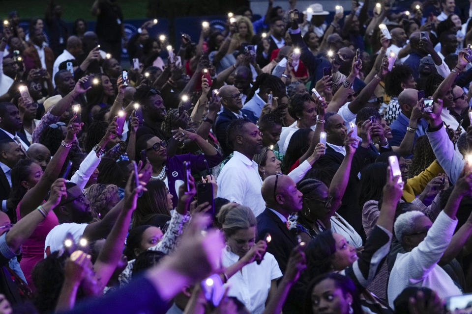 People listen as Rapper Doug E. Fresh performs during a Juneteenth concert on the South Lawn of the White House in Washington, Monday, June 10, 2024. (AP Photo/Susan Walsh)