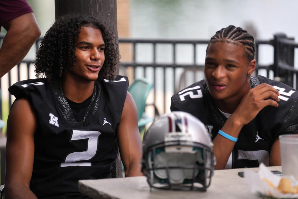 Hamilton safety Genesis Smith (2) and receiver TrÃ© Spivey (12) chat during Chandler Unified School Districtâ€™s Media Day with players from Arizona College Prep., Chandler, Hamilton, Basha, Casteel and Perry High Schools at Valle Luna Mexican Restaurant on Wednesday, Aug. 3, 2022.