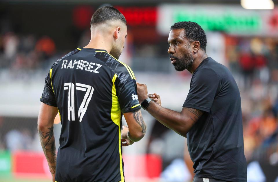 Columbus Crew SC head coach Wilfried Nancy talks with forward Christian Ramirez (17)