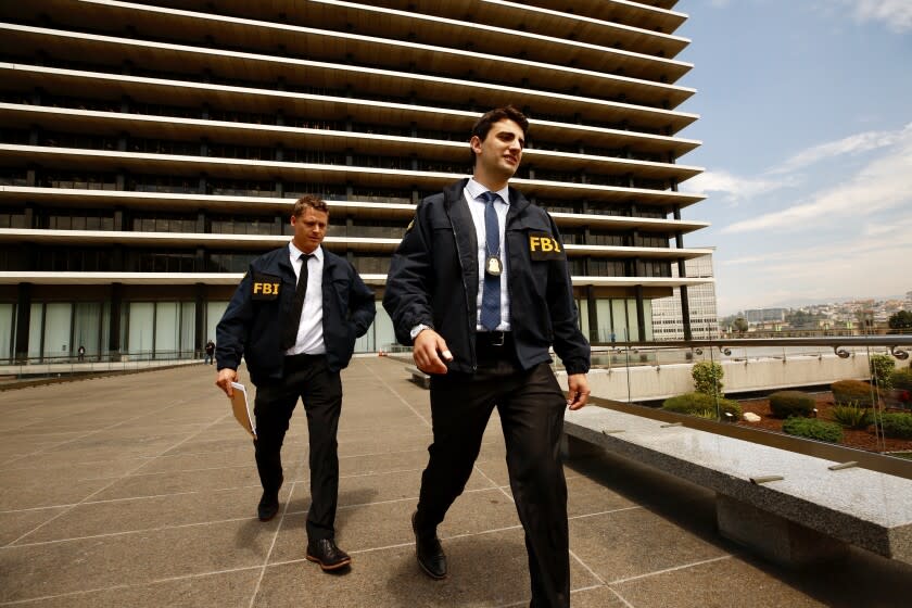 LOS ANGELES CA JULY 22, 2019 -- FBI agents leave the downtown headquarters of the Los Angeles Department of Water and Power after serving a search warrant Monday, July 22, 2019. Authorities have declined to discuss the nature of the investigation. (Al Seib / Los Angeles Times)