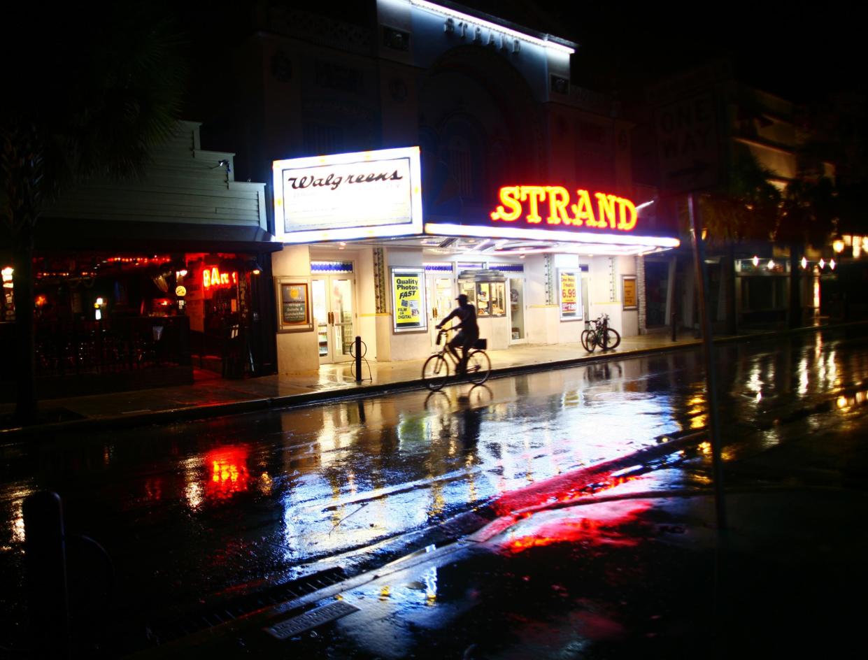 A man rides a bike along Duval Street in Key West, Florida. A gay couple were assaulted in a suspected hate crime on this street last week: Getty Images