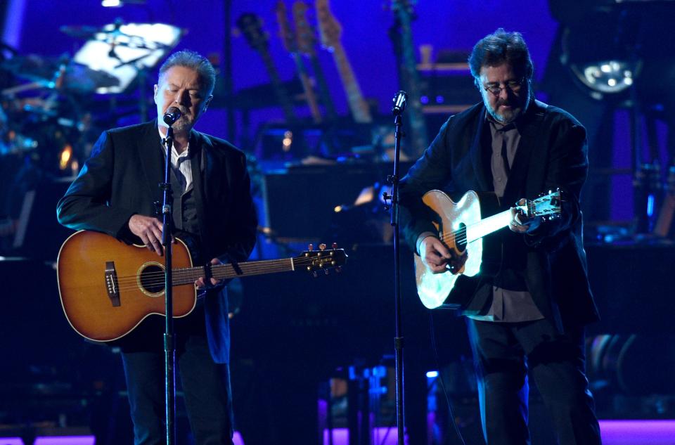 Don Henley, left, and Vince Gill perform "Eagle When She Flies" at MusiCares Person of the Year honoring Dolly Parton in Los Angeles. The Eagles are planning massive performances of their album "Hotel California" during their 2022 tour. Performances of the band's 1976 album will include an orchestra and a choir.