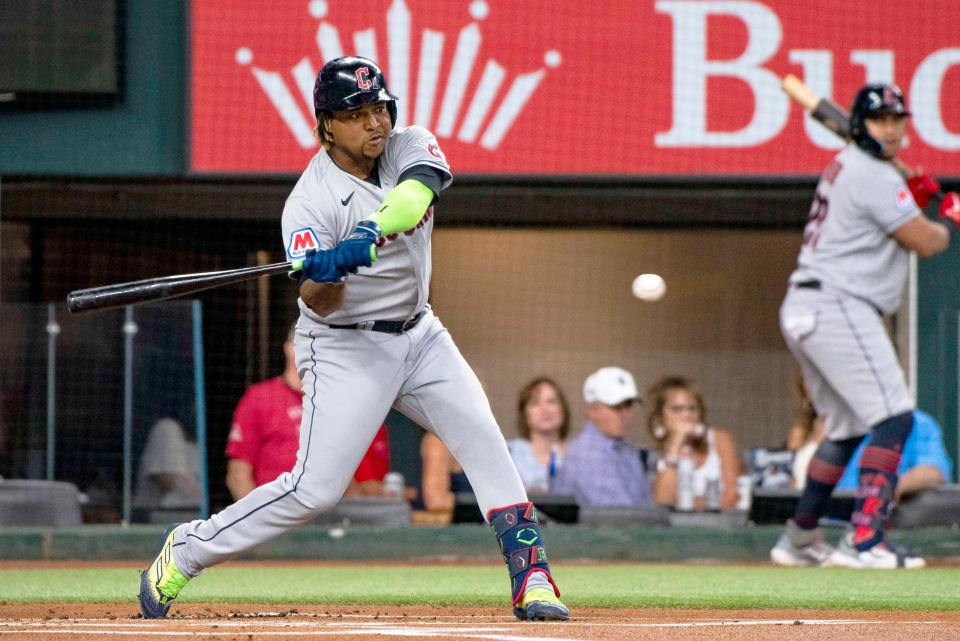 Cleveland Guardians' Jose Ramirez swings at a pitch in the top of the first inning during a baseball game against the Texas Rangers in Arlington, Texas, Saturday, July 15, 2023. (AP Photo/Emil T. Lippe)