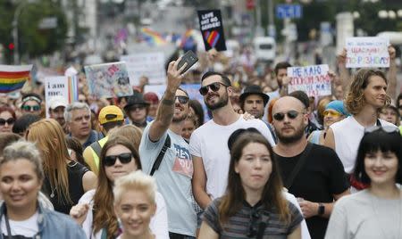 Participants take a selfie during the Equality March, organized by the LGBT community, in Kiev, Ukraine June 17, 2018. REUTERS/Valentyn Ogirenko