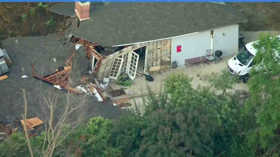 A home is red tagged after a mudslide in Sherman Oaks on March 13, 2024.