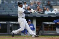 Aug 11, 2018; Bronx, NY, USA; New York Yankees third baseman Miguel Andujar (41) hits a two run home run against the Texas Rangers during the seventh inning at Yankee Stadium. Mandatory Credit: Brad Penner-USA TODAY Sports