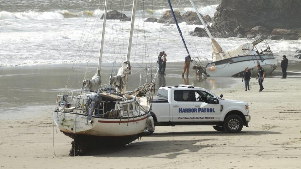 Three boats were stuck ashore at Port San Luis Harbor District beaches on Feb. 5, 2024, after a damaging atmospheric river storm brought high surf and swells to the Central Coast.