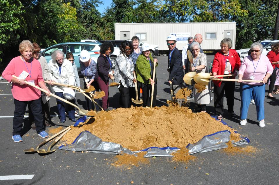 Officials and Friends of the Duck Creek Regional Library members celebrate the groundbreaking on Oct. 11, 2023, at 22 S. Main St. for the planned building which will replace the Smyrna Public Library about a block south.