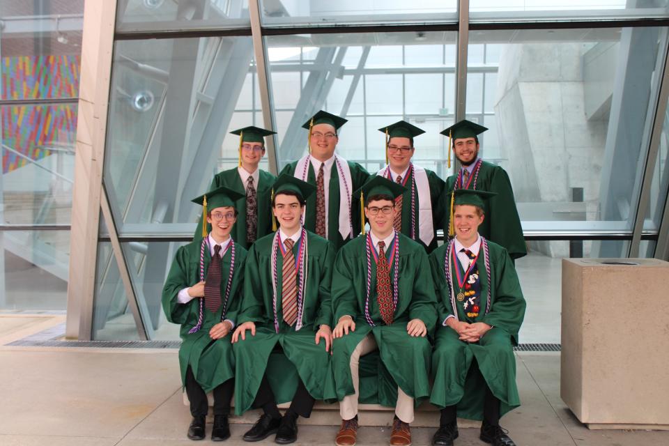Dan Spak's former robotics students graduated wearing one of their teacher's ties, a gift from Dan's widow, Mary. Back row, from left: Andrew Monachino, Trenton MacLean, Andrew Piunno, Andrew Stallsmith. Front row, from left: Eli Nisly, Urban Wimberly, Joseph Hohlefelder, William Forcey.